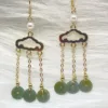 Elegant 'Safety Buckle Design Earrings' with jade disks and pearl accents, linked by gold-tone chains for a harmonious blend of tradition and style.