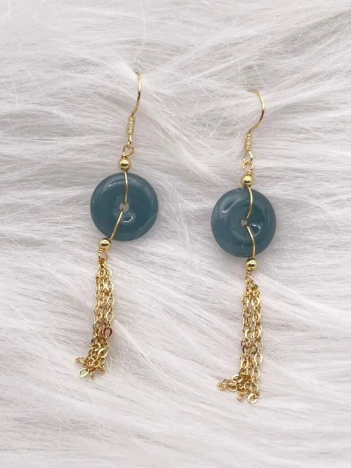 Elegant blue jade disc earrings with golden chain tassels from the 'Yearly Safety Design' series, epitomizing wishes of perennial peace.