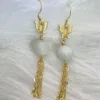 Elegant earrings featuring white jade orbs and golden butterflies, with flowing tassel chains, capturing the ethereal grace of 'White Jade Matching Pearls'.