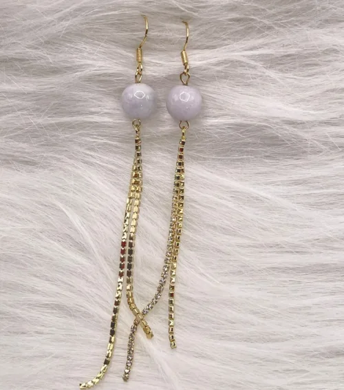 Elegant long-drop earrings featuring lavender jade orbs and embellished gold chains, symbolizing the wearer's enlightened journey represented by 'Every Path Leads to Purple Pearls'