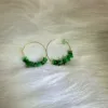 Green jade 'Every Path Leads to Fortune' hoop earrings with gold accents, symbolizing prosperity on life's journeys.