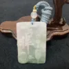 Carved jade pendant with Chinese characters on wooden stand.