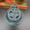 Jade dragon pendant on display