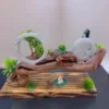 Carved jade peacock, ring, miniature trees on wooden base.