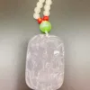 Carved jade pendant with beaded necklace.