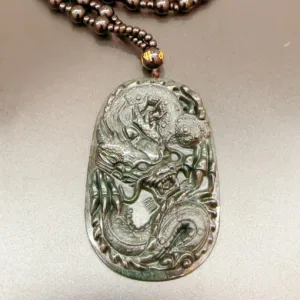 Carved dragon pendant on necklace jewelry