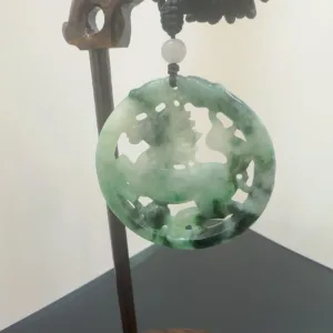 Carved jade pendant on display.