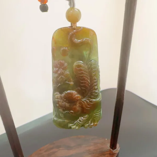 Carved jade pendant with dragon design.