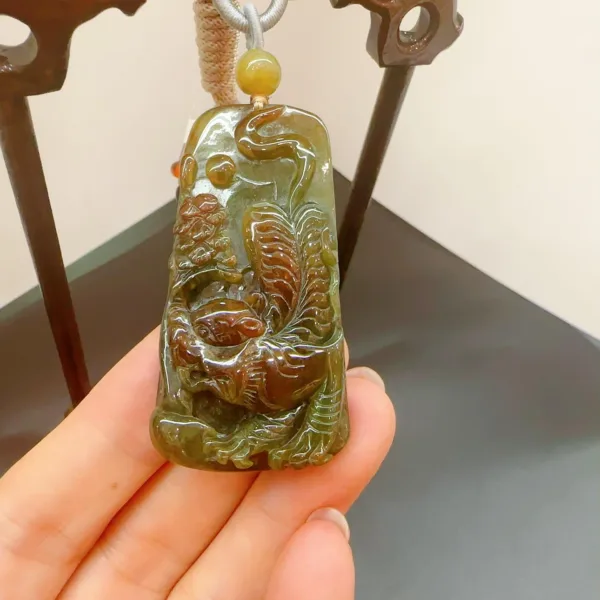 Carved jade pendant with intricate dragon design.