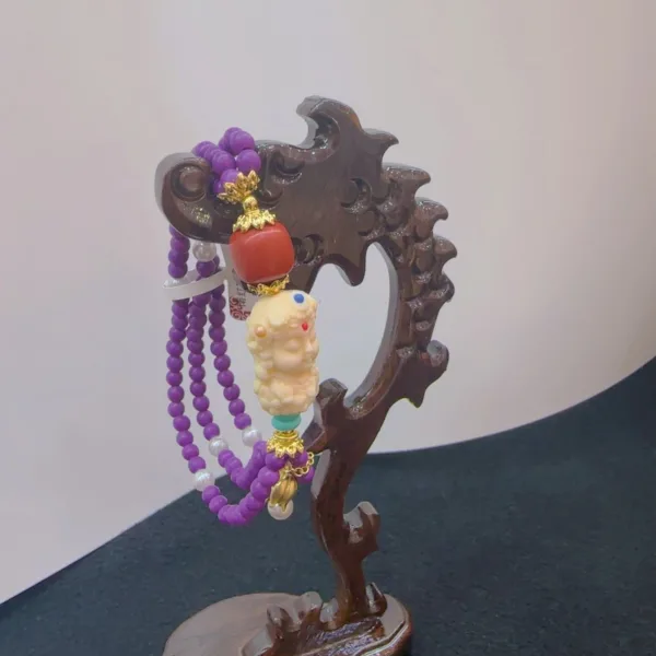 Decorative beaded jewelry on wooden stand.