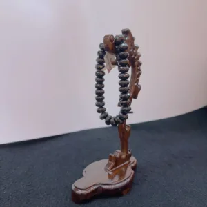 Wooden prayer beads display stand.