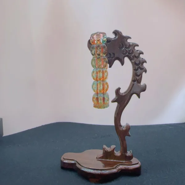 Decorative glass bubble tree sculpture on wooden base.