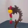 Colorful bead bracelet on wooden stand.