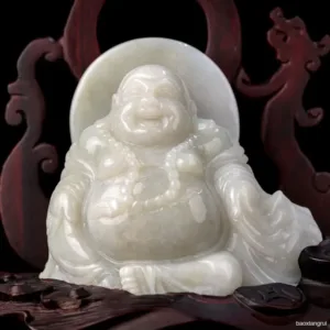 Carved white jade laughing Buddha statue.