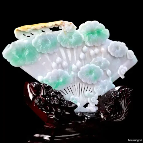 Intricate jade and gemstone carved decorative fan.