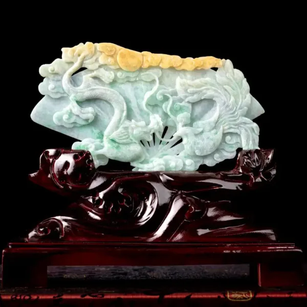 Jade dragon sculpture on wooden stand