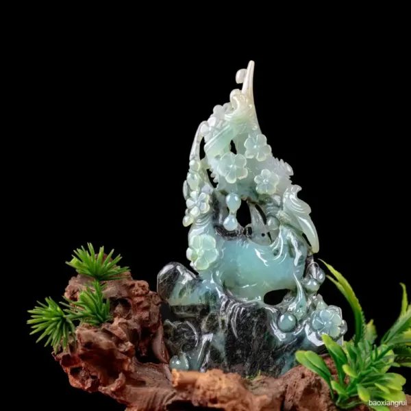 Jade figurine with flowering plants on wood base.