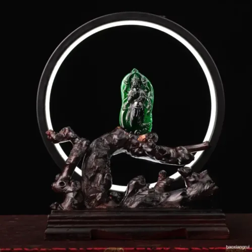 Fantasy sculpture with illuminated green backdrop.