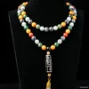 Colorful beaded necklace on black display.