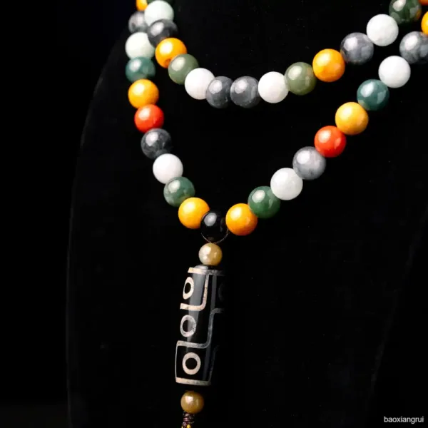 Multicolored bead necklace with tribal pendant.