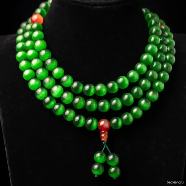 Green beaded necklace on black display