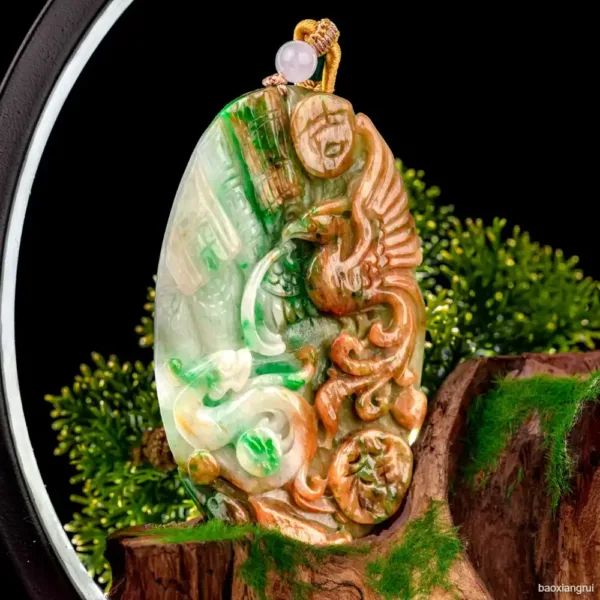 Carved jade dragon pendant with pearl.