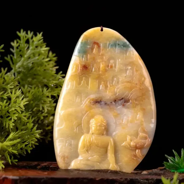 Carved Buddha in amber stone with greenery.