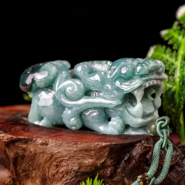 Jade dragon carving on wooden stump.