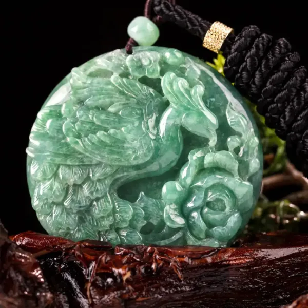 Carved jade pendant with black cord necklace.