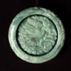 Carved jade pendant with dragon motif.