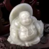 Carved jade laughing Buddha figurine.